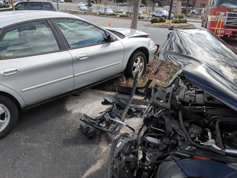 1971 Ford Ranchero - Two vehicles involved in a collision, showing significant front-end damage and debris on the road.