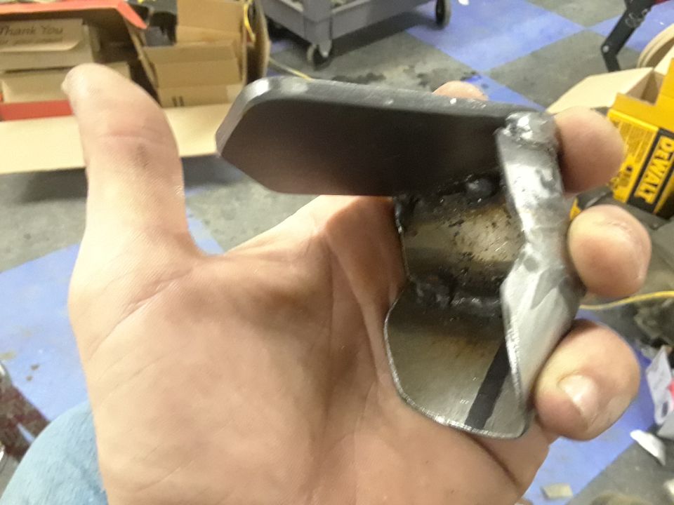 Metal bracket held in hand