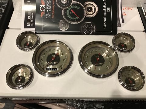 1923 Ford Model T - Classic Instruments gauges and installation manual for 1955-56 Chevy cars are laid out on a box.