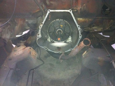 1978 Ford Bronco - Underside view of a transmission bell housing, showing the torque converter and surrounding components.