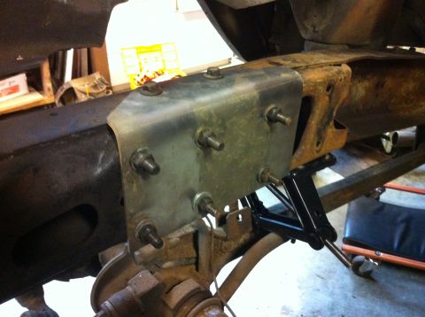 1978 Ford Bronco - Close-up of a custom bracket attached to a vehicle's frame during a build.