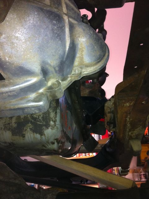 1978 Ford Bronco - Close-up of vehicle undercarriage components, likely transmission and suspension parts.