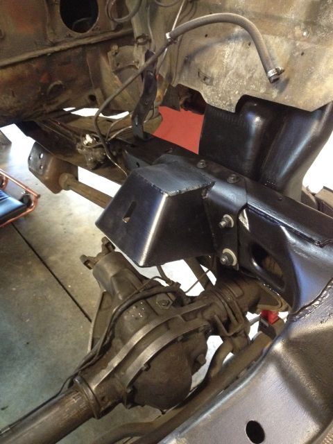 1978 Ford Bronco - Close-up view of custom fabricated bracketry installed on the vehicle's frame and drivetrain components.