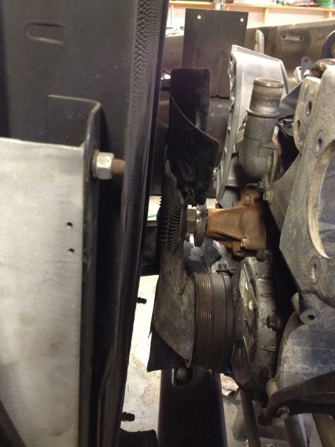 1978 Ford Bronco - Close-up view of engine components, including a water pump and fan pulley.