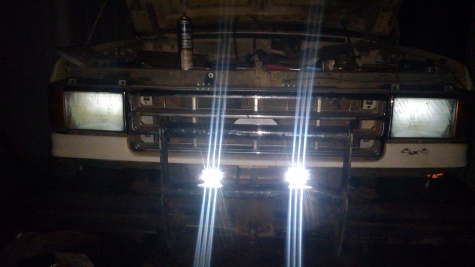 because the truck is using a 92-96 harness, there are unused running lights used in the 87-91. i used these to wire up LED pods for extra lighting. 

i also have some cheap BEAMTECH fanless LED headlights and sealed the headlight housing so water can not get into them, if water does get into them it will not shatter halogen bulbs. and the LEDs hopefully will be cool enough to prevent condensation inside the lens since the housing is now sealed. the fanless design means mud will not cause the fans to fail to cool.

the battery was only at 7 volts so the lights are very dim in the picture.