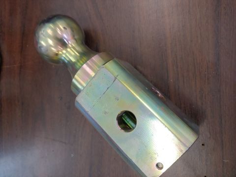 1995 Ford Bronco - A trailer hitch ball mount is shown against a wooden background. The registry claims it is from a 1995 Ford Bronco, but this is unlikely.