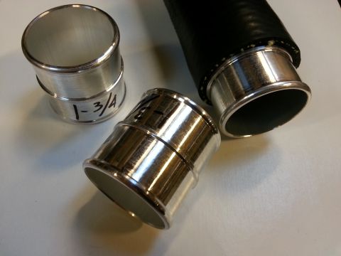 1978 Ford Bronco - Three aluminum hose adapters are shown on a white surface. One adapter is labeled "1-3/4" and another is partially visible with markings. A…
