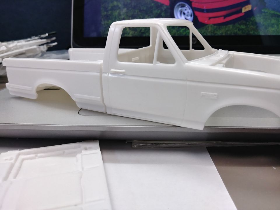 XLT trim removed from this side of the cab and front fender. The front wheel arch trim has also been removed.