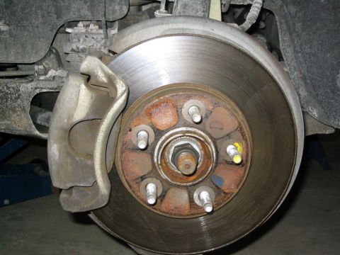 1996 Mercury Sable - This image shows a close-up view of a vehicle's brake system, focusing on the rotor and caliper.