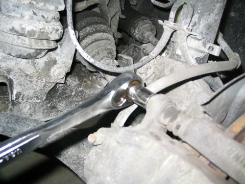 1996 Mercury Sable - A wrench is used to service the brake caliper assembly on a vehicle.