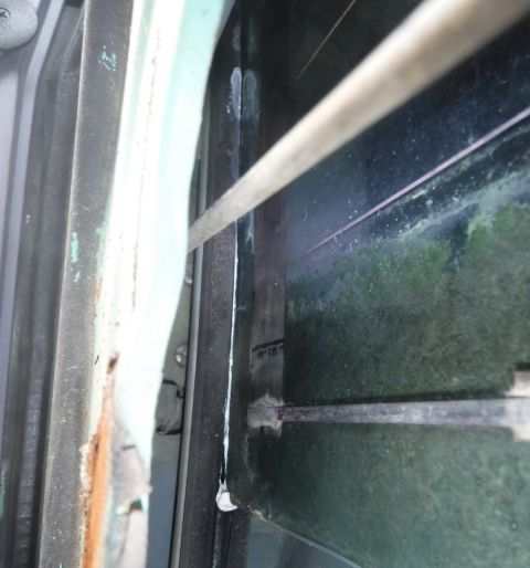1992 Ford Bronco - Tailgate glass, passenger side, bottom of the defrost grid's vertical band is completely worn through where it rests on the inner sweep...m…
