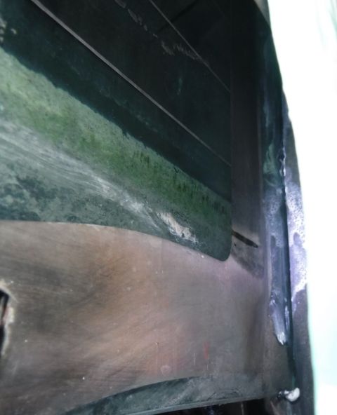 1992 Ford Bronco - Tailgate glass, drivers side, bottom of the defrost grid's vertical band is almost worn through in the same spot.