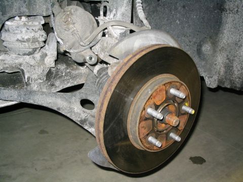 1996 Mercury Sable - This photo shows a close-up view of a car's brake rotor and caliper assembly.