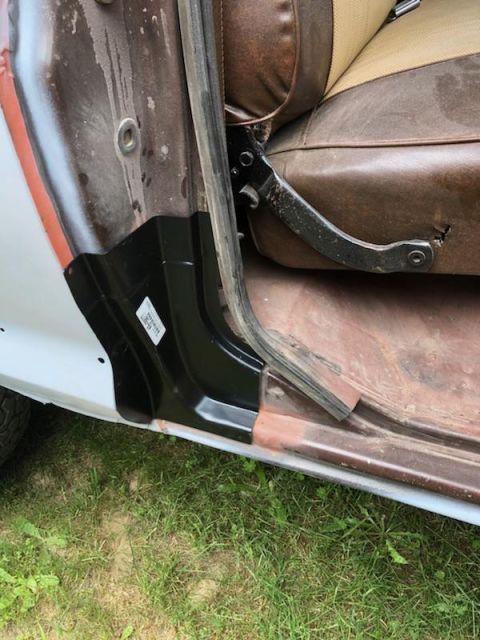 1978 Ford Bronco - A black aftermarket rocker panel has been installed on the lower door jamb of a vehicle, covering the original metal which shows signs of r…