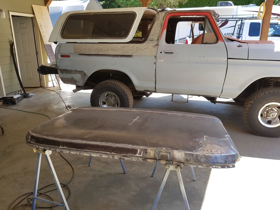 1978 Ford Bronco with roof removed, undergoing restoration.