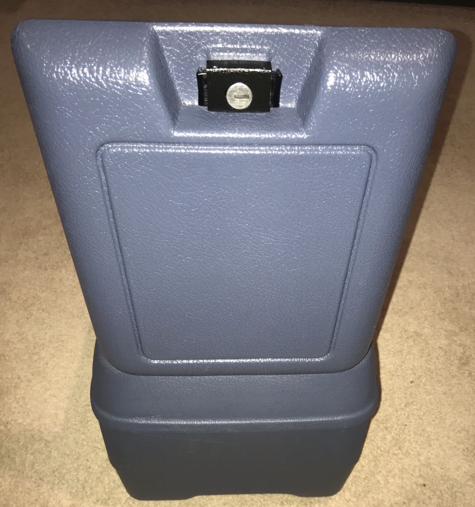 Blue plastic armrest console with black lock