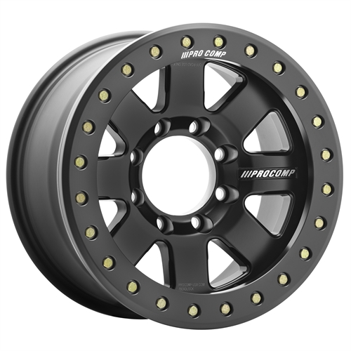 Black Pro Comp beadlock wheel with gold lug nuts