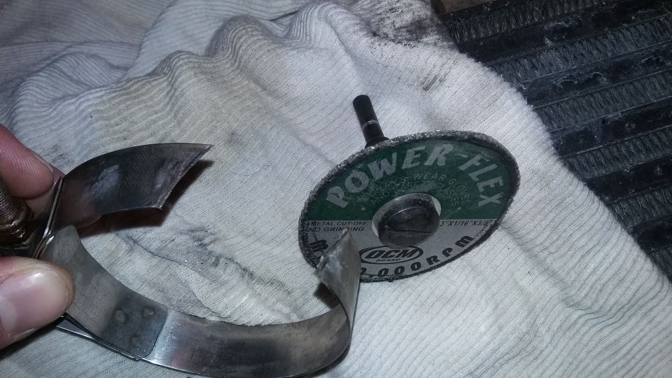 Cut metal clamp and a cut-off wheel