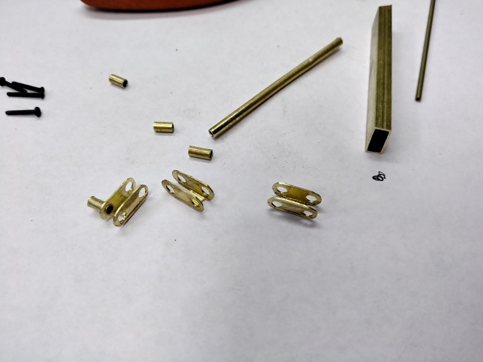 Rectangular bras tube was cut, drilled, and shaped to form shackles for the leaf mounts.