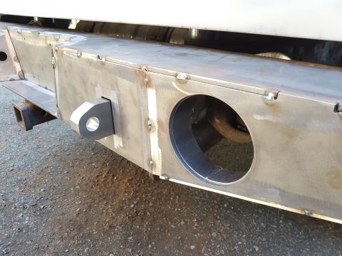 1978 Ford Bronco - Close-up of a custom-fabricated steel rear bumper with integrated tow hitch and recovery point.