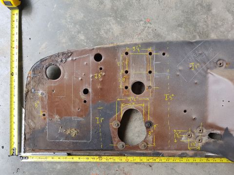 1978 Ford Bronco - A heavily rusted metal panel is marked with yellow lines and measurements, indicating it is a vehicle part.