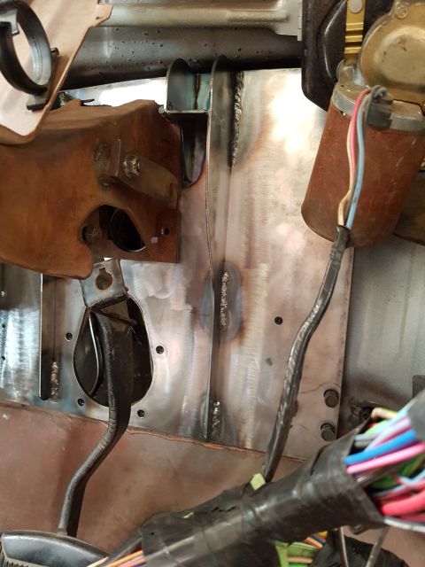 1978 Ford Bronco - Interior view of a vehicle's firewall, showing pedals and wiring.