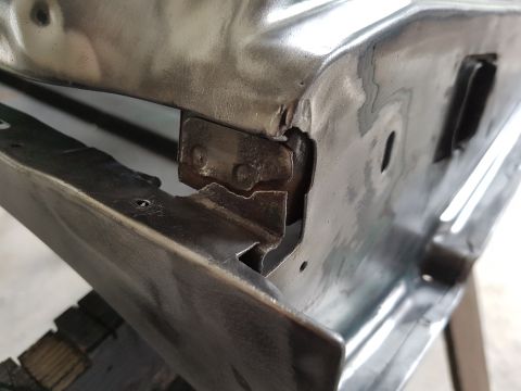 1978 Ford Bronco - Detail of a vehicle's bodywork, showing a latch mechanism. The SuperMotors.net logo is visible in the lower right corner.