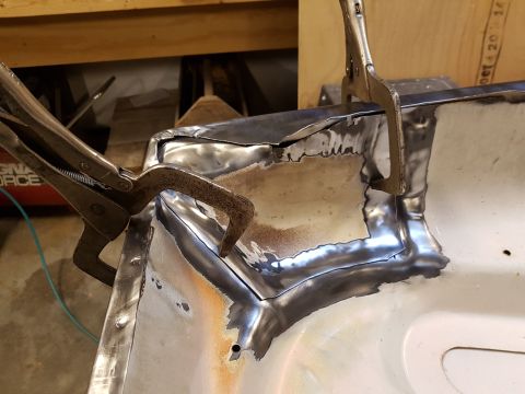 1978 Ford Bronco - Metal body panel is being welded with clamps holding it in place.