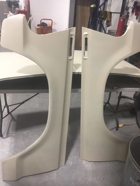 1978 Ford Bronco - Two beige front fender panels are shown, likely for a classic vehicle restoration project.