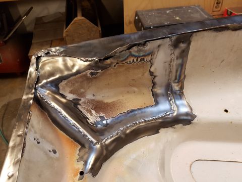 1978 Ford Bronco - Metal panel repair with visible welding and cutouts, likely part of a larger restoration project.