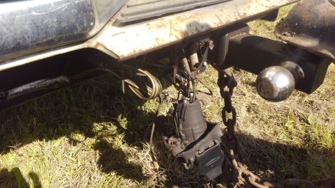 1990 Ford F-250 - Close-up of a trailer hitch assembly, showing the ball mount and electrical connections.