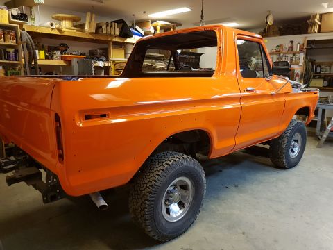 1978 Ford Bronco - This 1978 Ford Bronco is shown in a garage, likely undergoing restoration or modification.