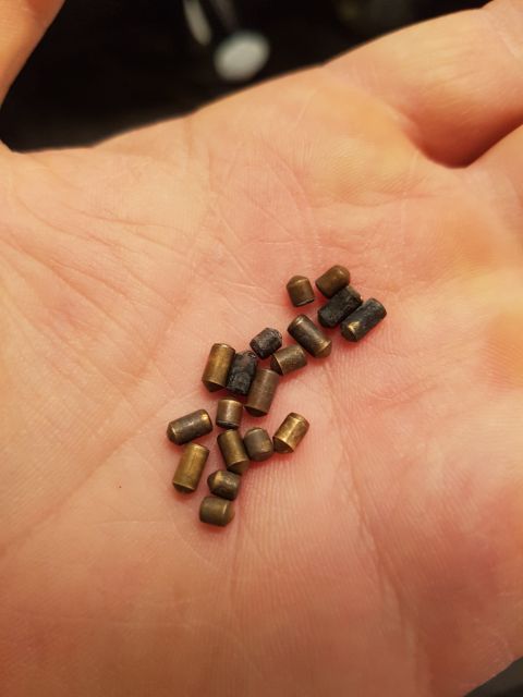 1978 Ford Bronco - A collection of small metal pins, possibly for a vehicle repair, are displayed in a person's hand.