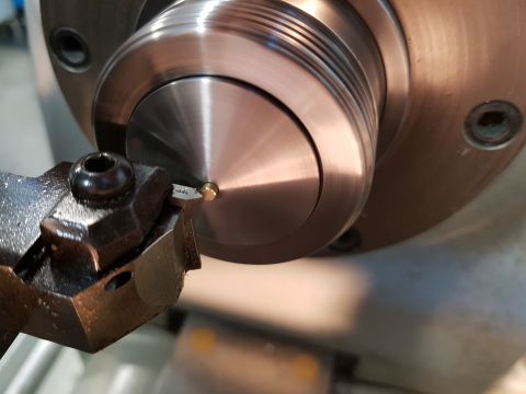 1978 Ford Bronco - Machining a small metal component on a lathe.