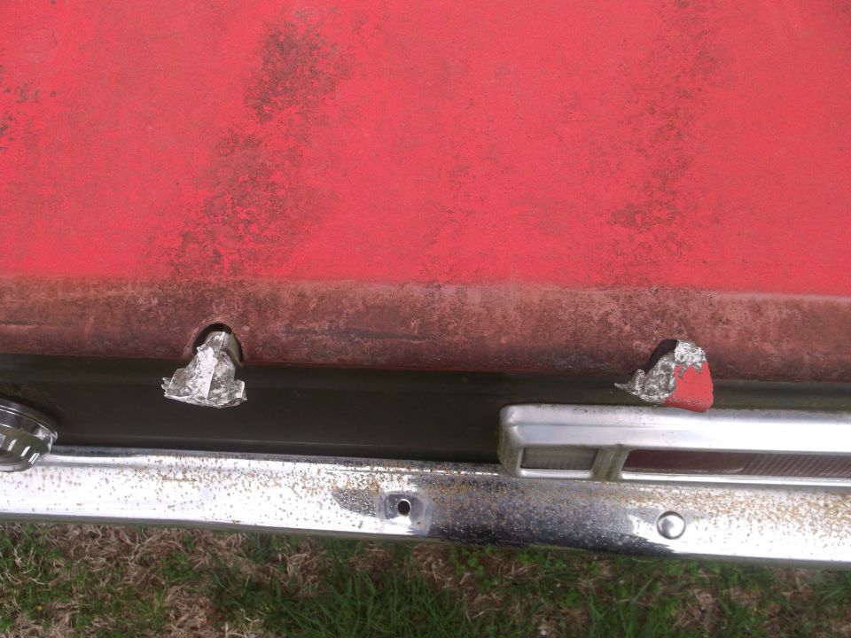 1972 Ford Maverick rear bumper with chrome trim and a red taillight visible
