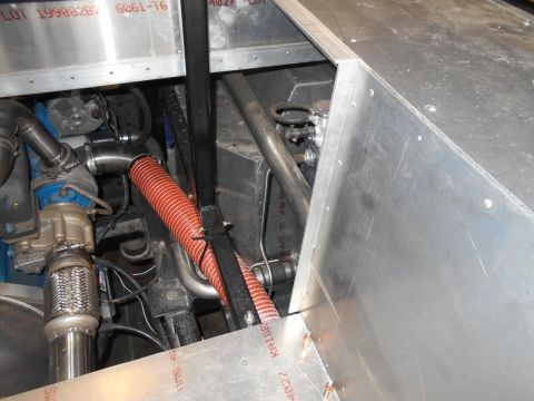 1992 Ford Bronco - Close-up view of an engine compartment, showing various mechanical parts and aluminum construction.