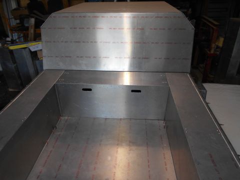 1992 Ford Bronco - This image shows the interior of an aluminum truck bed, with text visible on the side panels.