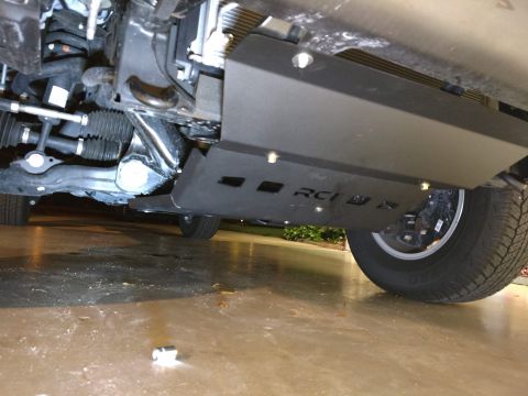 2018 Toyota 4Runner - Close-up of the vehicle's undercarriage, showing the RCI Offroad skid plate and suspension components.