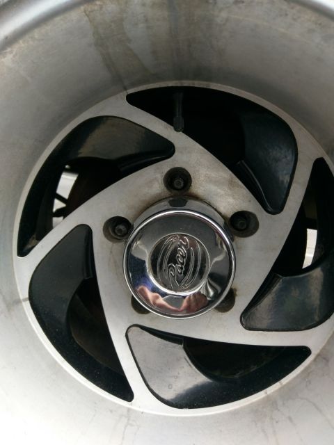 1988 Ford Bronco - A close-up shot focuses on the Pacer brand center cap of a custom wheel.