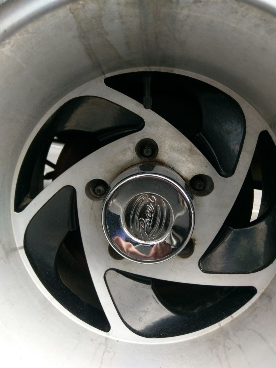 Close-up of a Pacer wheel with a chrome center cap