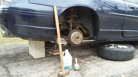 2000 Pontiac Grand Prix side view, wheel removed, supported by blocks