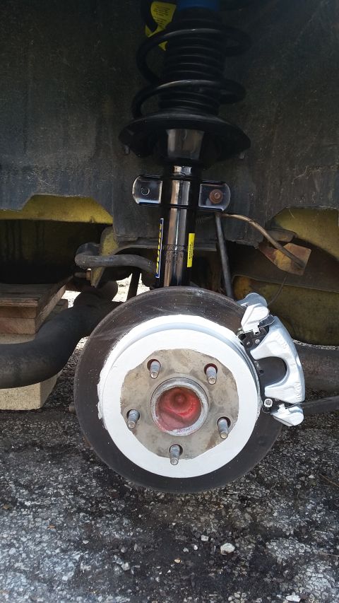 Rear brake rotor and caliper assembly