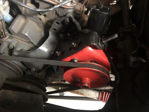 1978 Ford Bronco - Engine motor mount bracket with belt and pulley system.