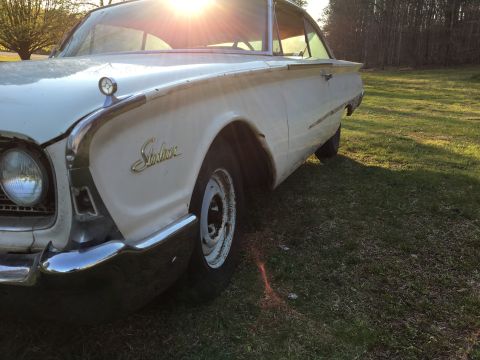 1960 Ford Starliner - A white 1960 Ford Starliner is seen from a 3q-front angle, with the Starliner script visible on the fender.