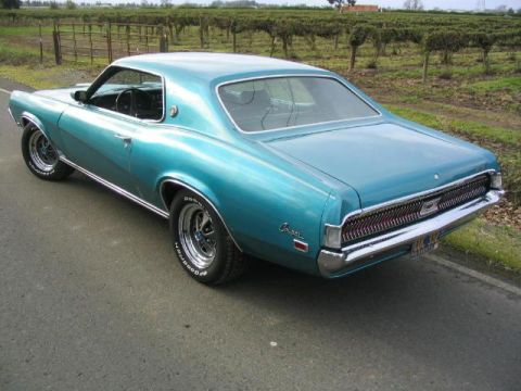 1969 Mercury Cougar - This 1969 Mercury Cougar is a teal coupe with chrome accents and a distinctive grille.