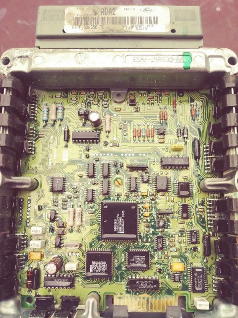 1996 Ford Bronco - Internal view of a Ford ECU circuit board, showing intricate electronic components and wiring.