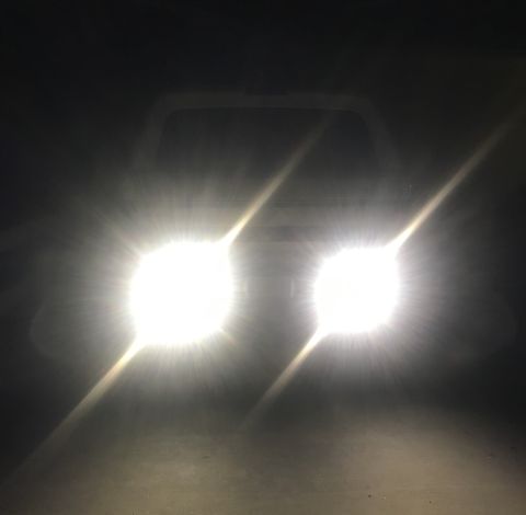 1995 Ford Bronco - The bright headlights of a 1995 Ford Bronco illuminate the darkness.