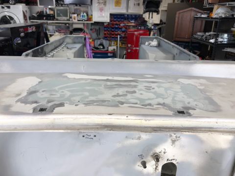 1992 Jeep Wrangler - The rear body section of a vehicle is shown undergoing repair work, with visible patching and some handwritten notes.