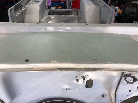 1992 Jeep Wrangler - The cowl area of a Jeep tub shows signs of body filler application and repair work.