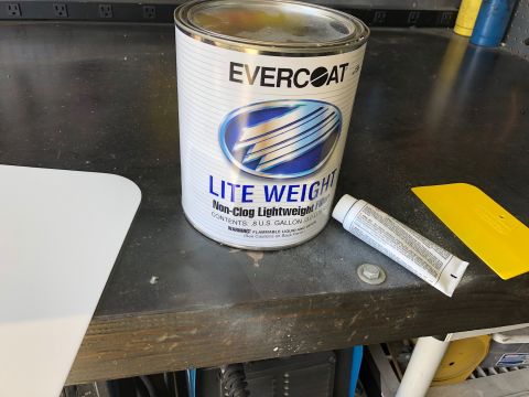 1992 Jeep Wrangler - A can of Evercoat Lite Weight filler is shown with a squeegee and a tube of hardener, likely for automotive body work.